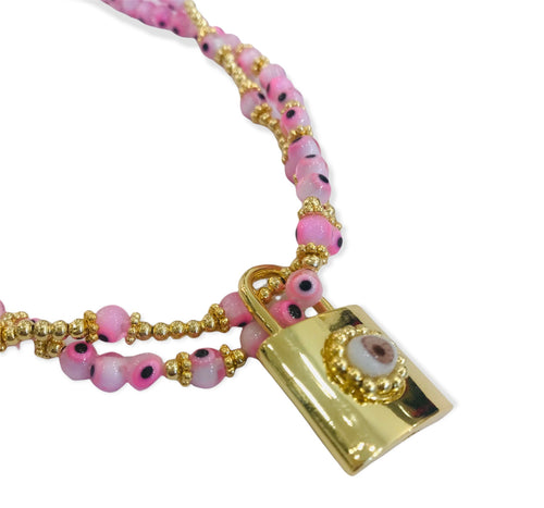 Pink necklace with padlock and little eyes
